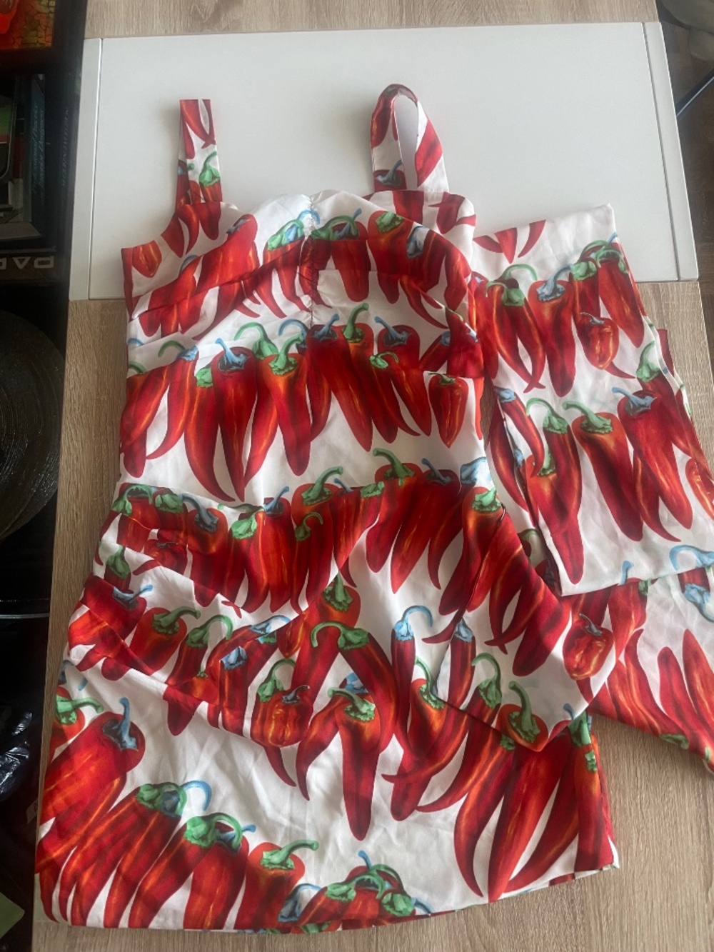 Red chili pepper print ruched mini dress featuring a side bow accent - Picture 9 of 10